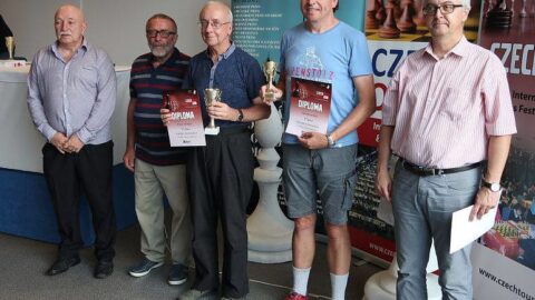 Paul, in the centre. collects his prize
