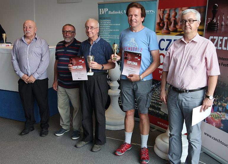 Paul, in the centre. collects his prize